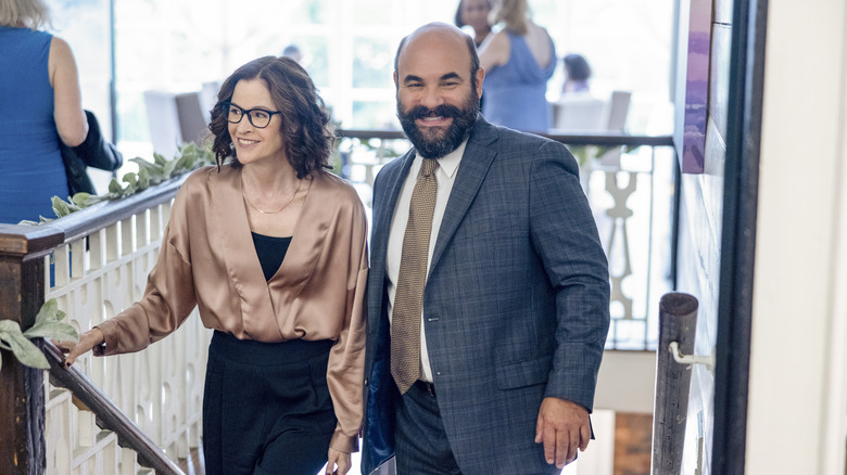 Ally Sheedy and Ian Gomez walking up stairs