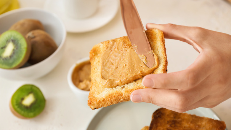 almond butter spread on bread kiwis