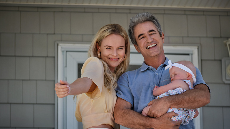 Heidi, Robert, and baby smiling