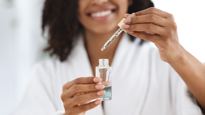 Woman holding a serum