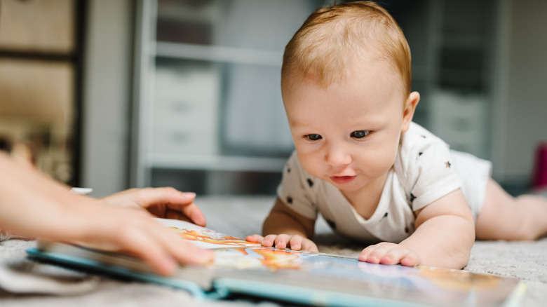 Baby reading a book