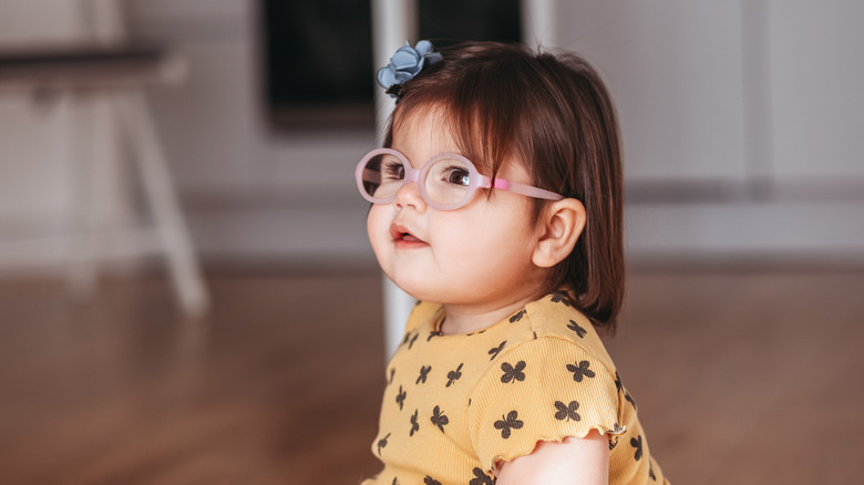 Baby girl wearing glasses