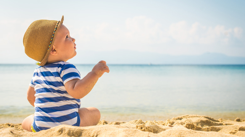 Baby sitting on beach