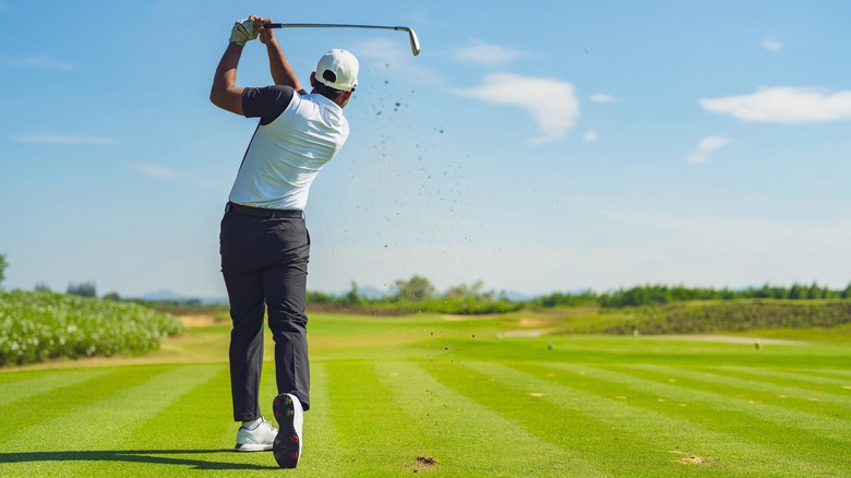 A man golfing