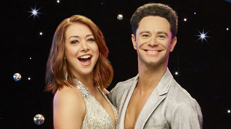 Alyson Hannigan and Sasha Farber grinning and sparkling