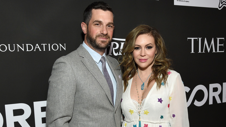 David Bugliari and Alyssa Milano posing at event