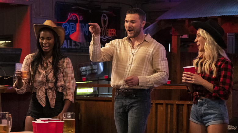 L-R: Brookell, Steven and Amanda playing beer pong in the two-hour "2 Joes Are Better Than 1" series premiere episode of JOE MILLIONAIRE: FOR RICHER OR POORER