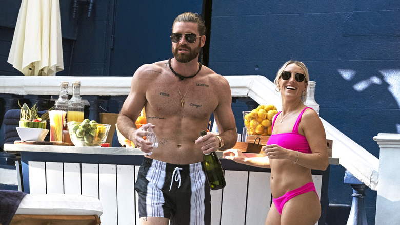 L-R: Kurt and Amanda wearing swimsuits in the "Pool Party Paradise" episode of JOE MILLIONAIRE: FOR RICHER OR POORER