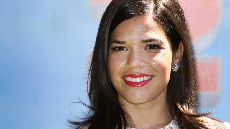 America Ferrera smiling, looking glamorous