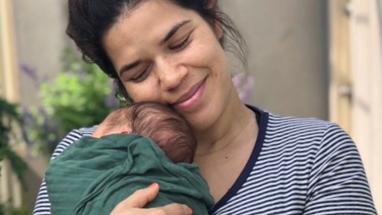 America Ferrera holding baby