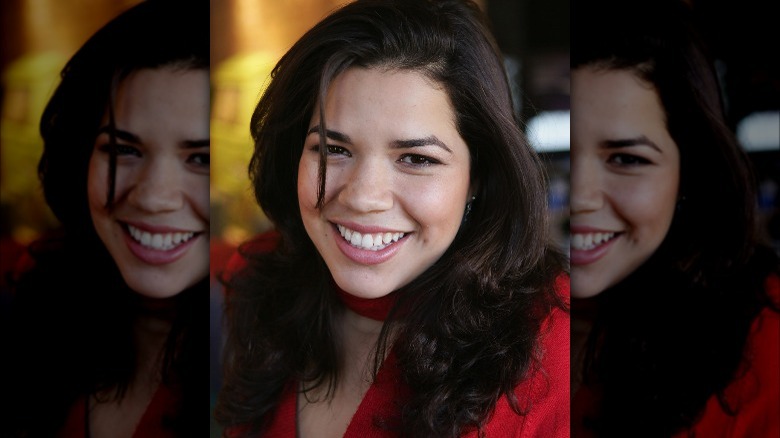 America Ferrera wearing red, smiling