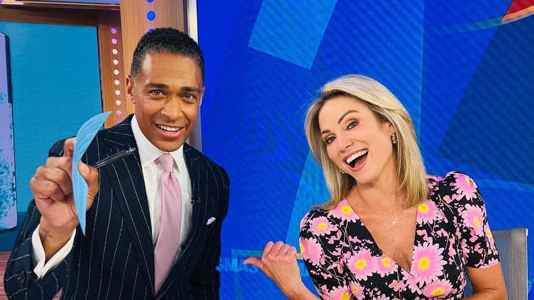 T.J. Holmes and Amy Robach smile