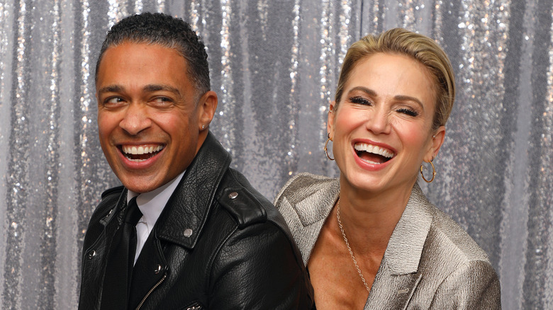 Amy Robach and T.J. Holmes laughing
