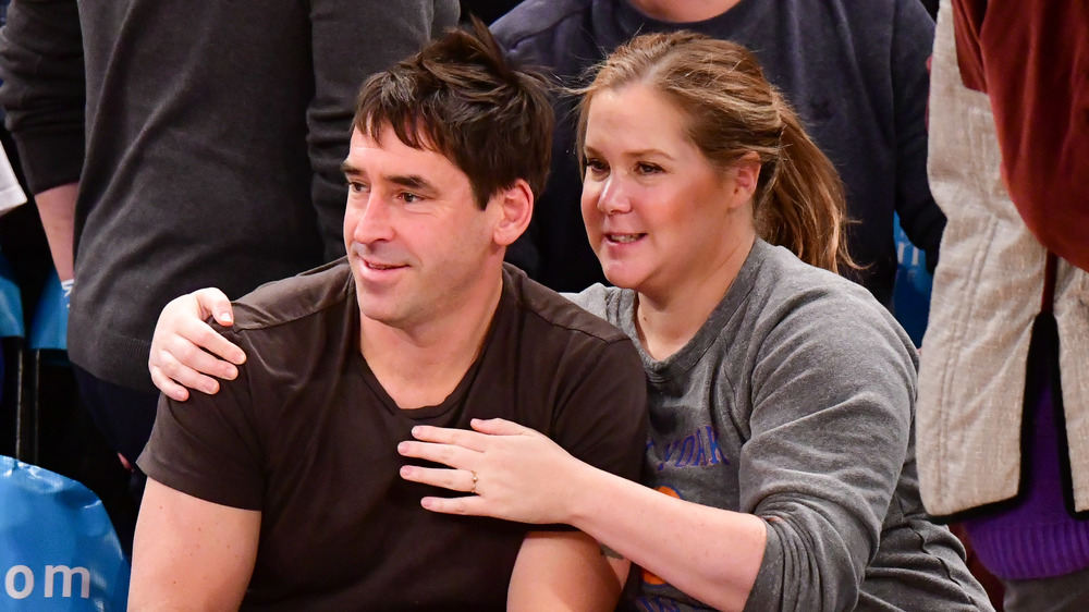 Amy Schumer and Chris Fischer at game