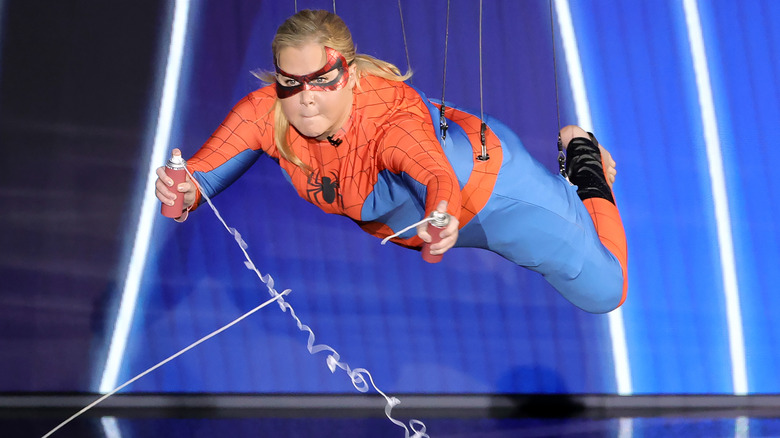 Amy Schumer wears a Spider-Man costume at the Oscars