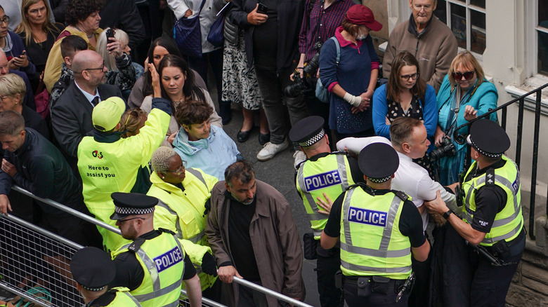 man arrested before cortege carrying coffin 