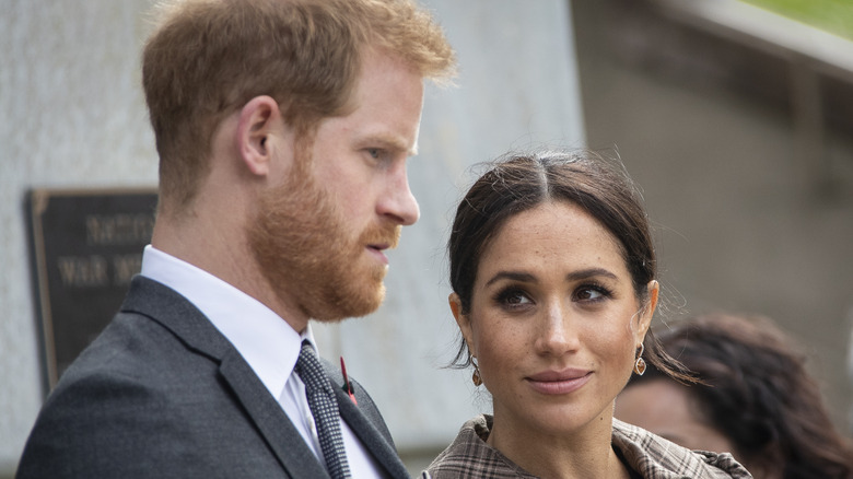 Meghan Markle looks knowingly at Prince Harry