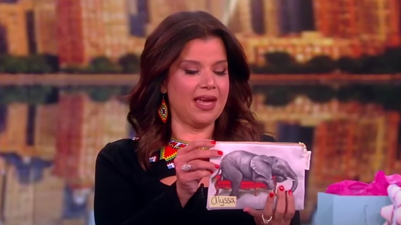 Ana Navarro holding an elephant pouch