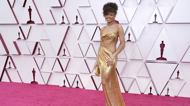 Andra Day Oscar long view of gold Oscars dress.