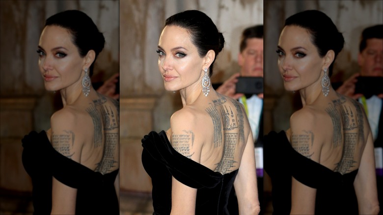 Angelina Jolie looking over her shoulder at an event