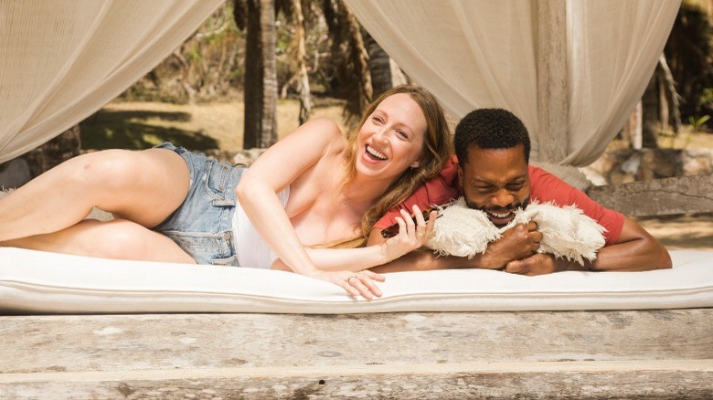Anna Konkle and Jermaine Fowler lying on the ground and laughing