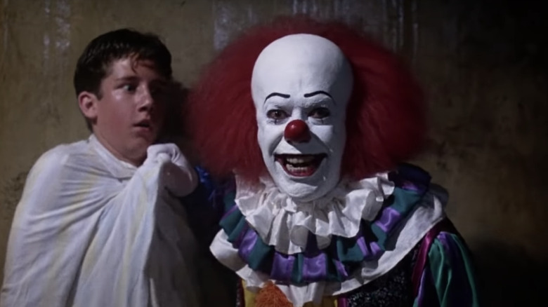 Tim Curry as Pennywise in It