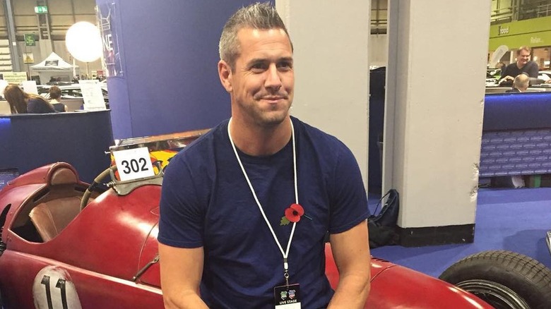 Ant Anstead sitting on car