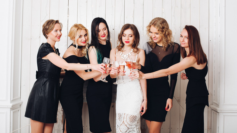 bride-to-be in white dress at party