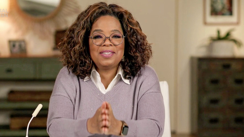 Oprah Winfrey purple sweater