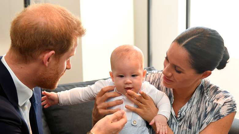 Prince Harry and Meghan Markle looking at baby Prince Archie