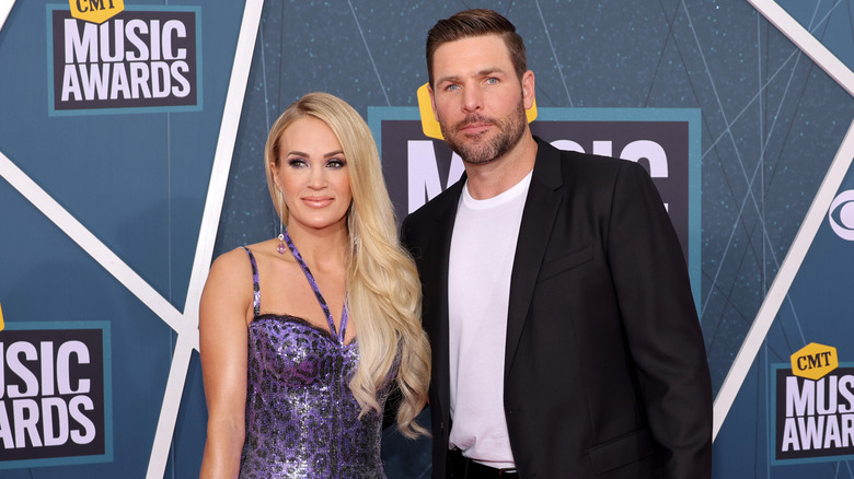 Carrie Underwood and Mike Fisher on the red carpet for the 2022 CMT Music Awards