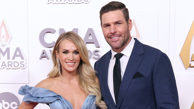 Carrie Underwood and Mike Fisher on the red carpet for the 2022 CMA Awards