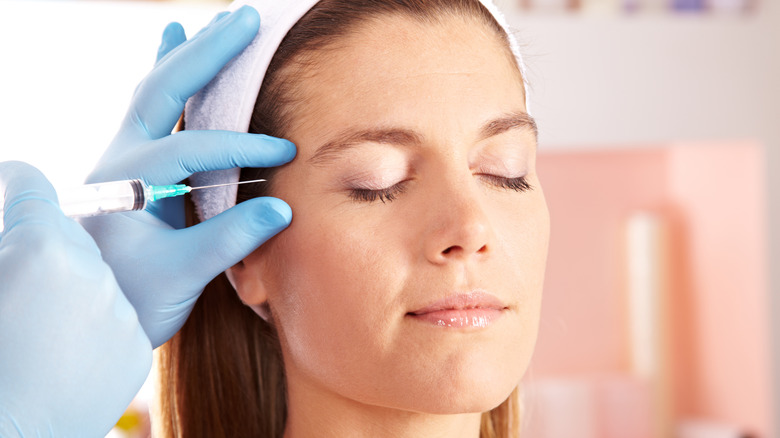 Woman getting botox injection