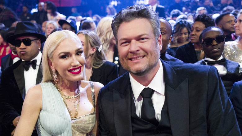 Gwen Stefani and Blake Shelton at an event. 