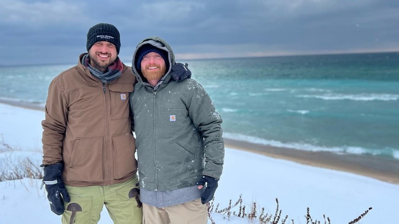 Evan Thomas and Keith Bynum on snowy beach