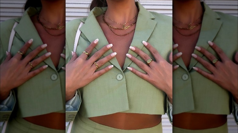 Woman wearing imPress press on "So French" modern manicure nails