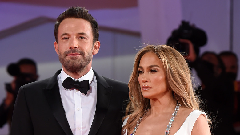 Ben Affleck and Jennifer Lopez pose for the cameras. 