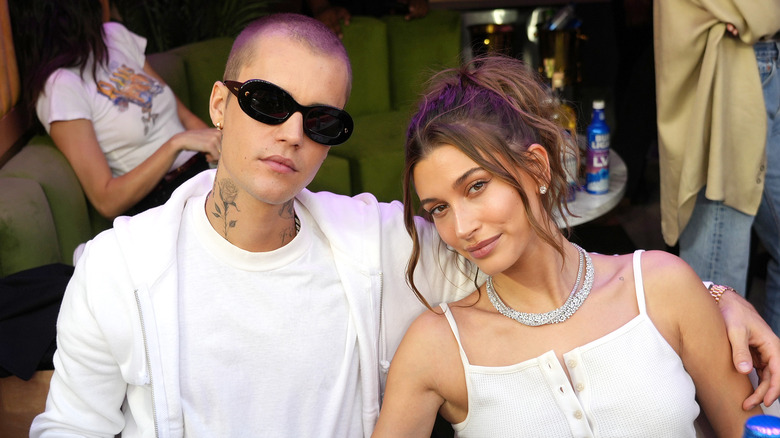 Justin and Hailey Bieber pose for a photo together. 