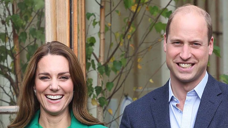 Kate Middleton and Prince William pose for a photo. 