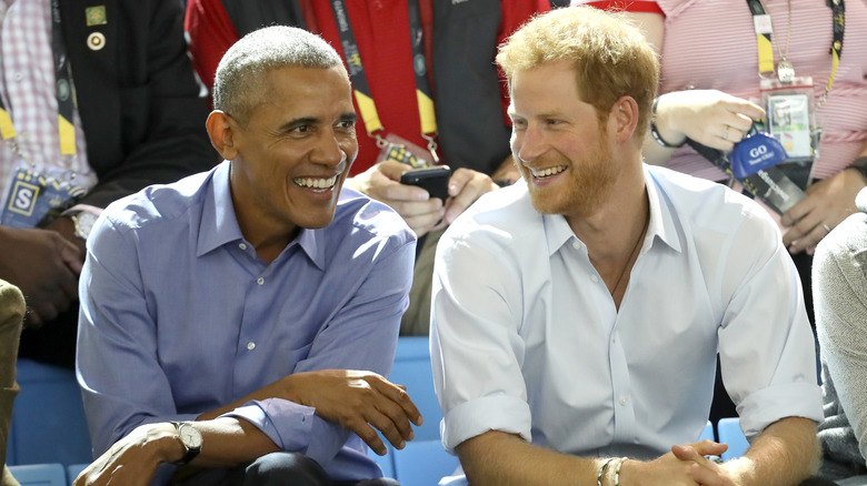 Barack Obama and Prince Harry smiling