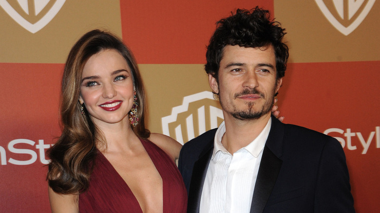 Miranda Kerr and Orlando Bloom pose on the red carpet