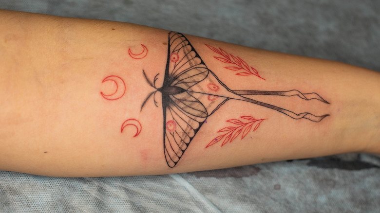 Beautiful tattoo on woman's arm