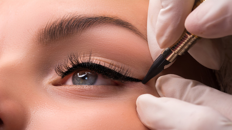 Woman applying makup