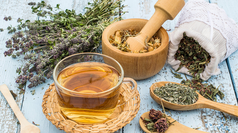 Cup of tea with loose leaf herbs