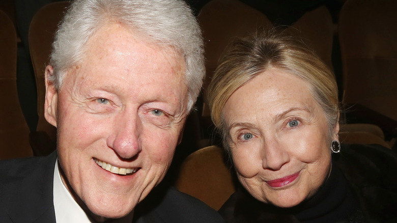 Hillary and Bill Clinton sitting next to each other at a Broadway show