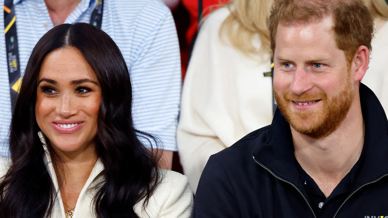 Prince Harry and Meghan Markle smiling