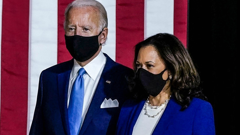 Joe Biden and Kamala Harris standing