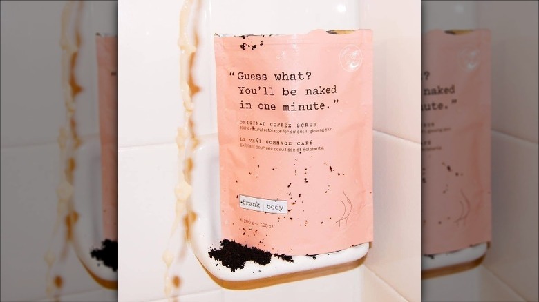 Frank Body Original Coffee Scrub sitting in a shower