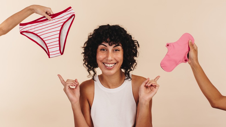 Woman smiling and pointing