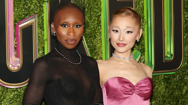 Ariana Grande posing for photos with Cynthia Erivo